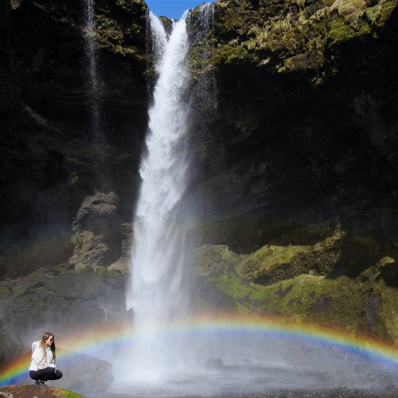 Photo showing the waterfall and rainbow.
